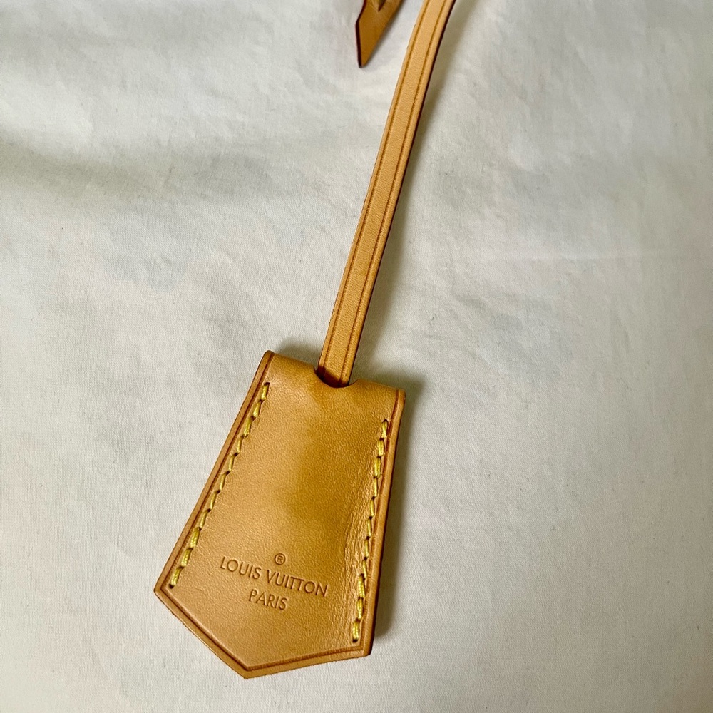 Authentic Louis Vuitton vachetta clochette